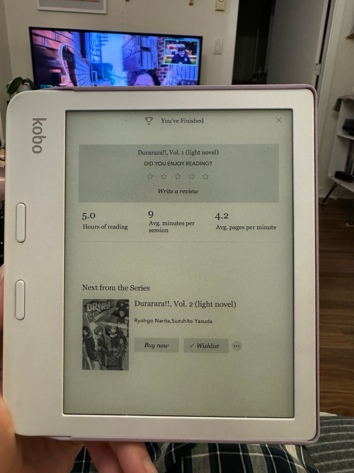 Photo of a Kobo reader, showing 5 hours of reading time, 9 minutes average per session and 4.2 pages per minute