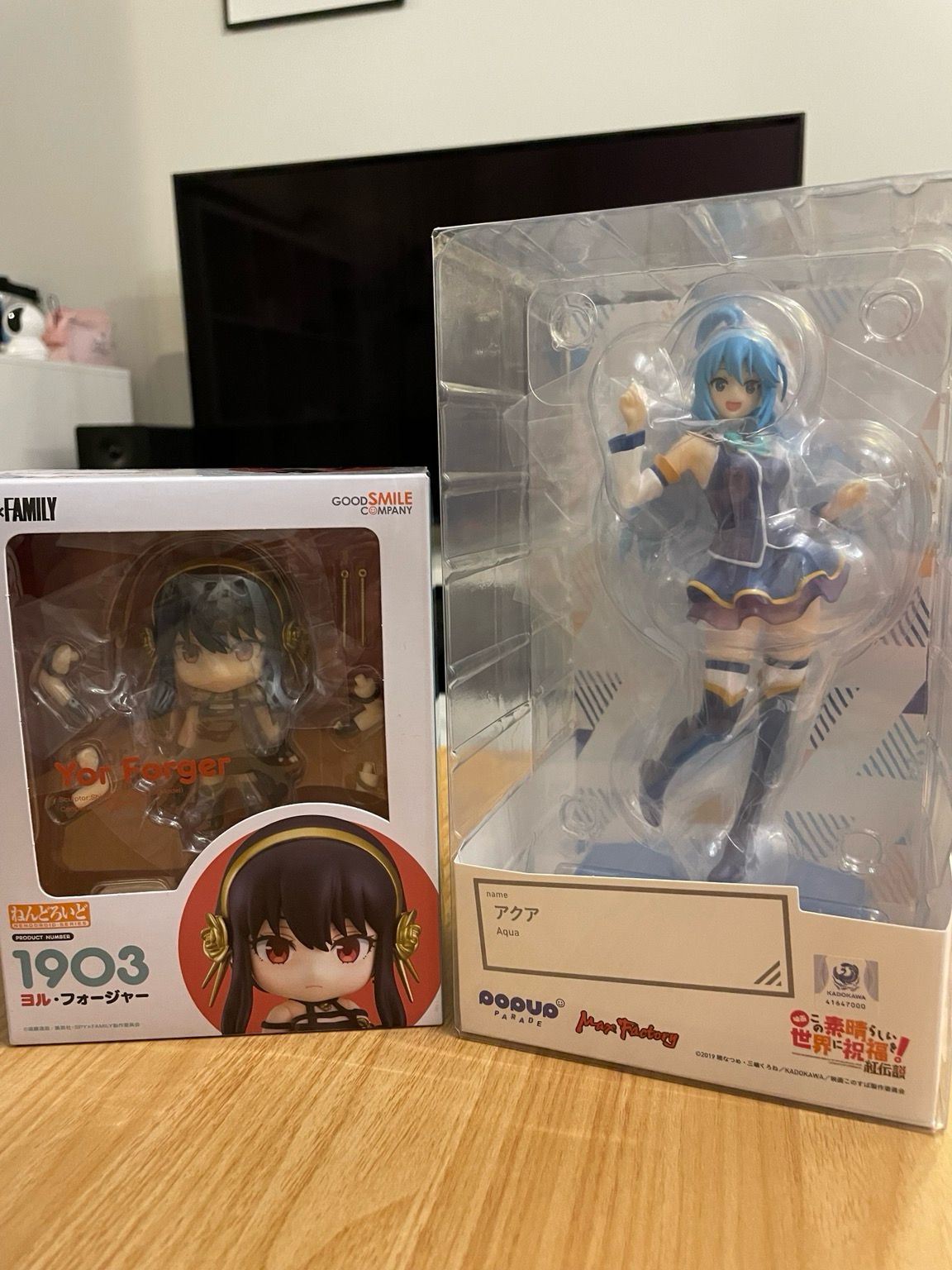 Photo showing two anime figures: Yor from Spy x Family, and Aqua from Konosuba
