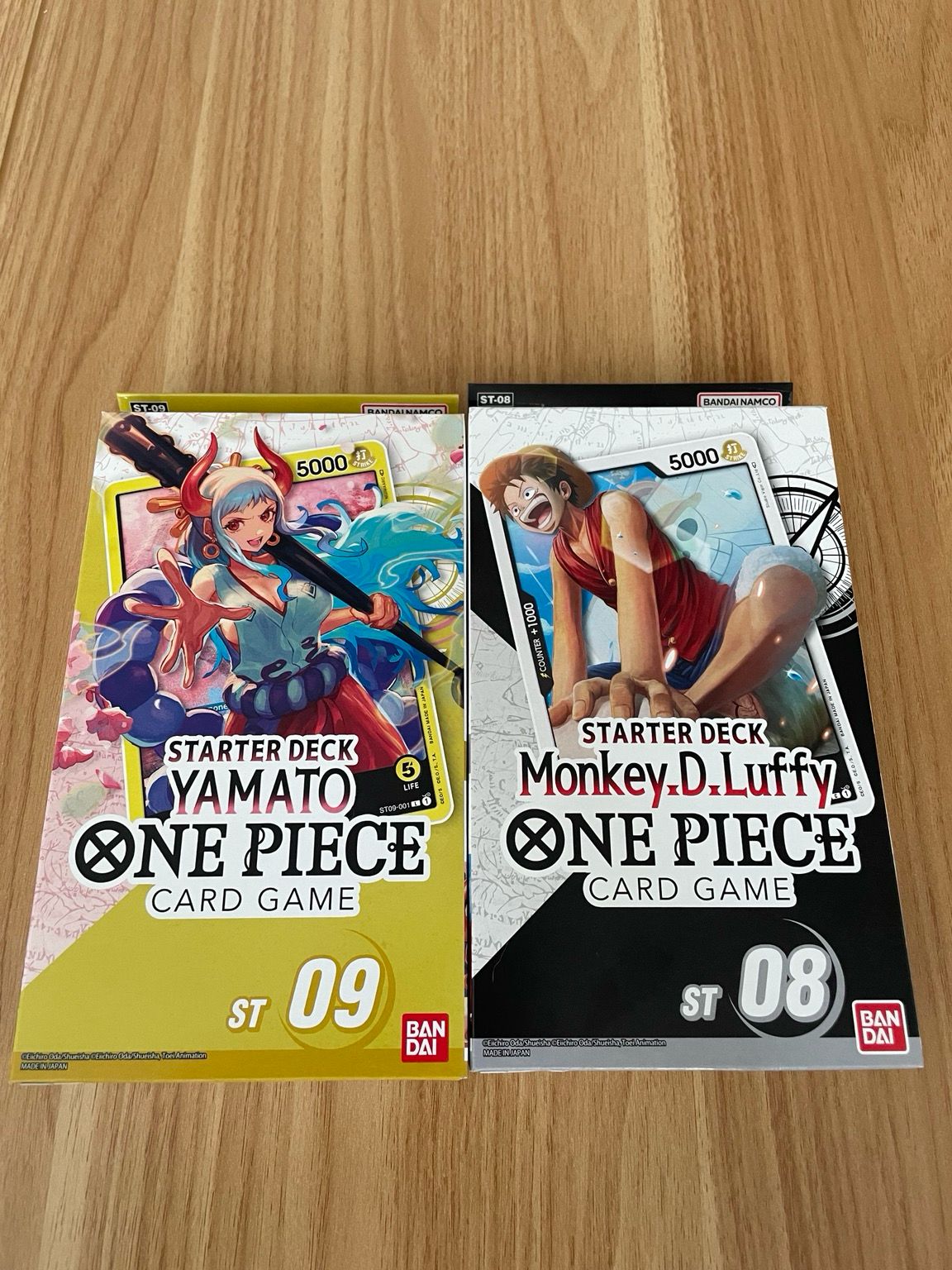 Photo showing two boxes of One Piece TCG: Yamato and Mobkey D. Luffy