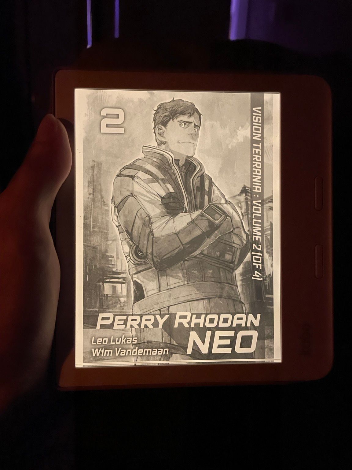 Photo of a Kobo reader, showing the Perry Rhodan NEO vol 2 cover: a man is a space suit with crossed arms 